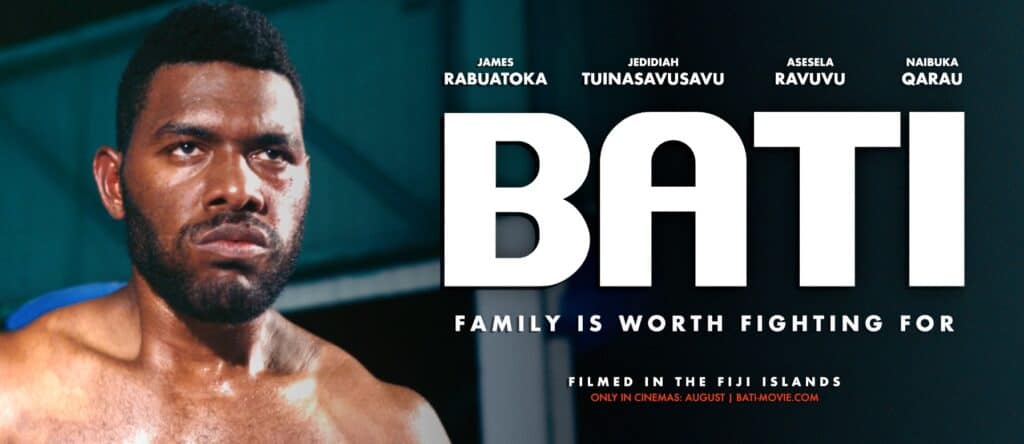 Photo of a bare chested man with the words Bati next to his face.