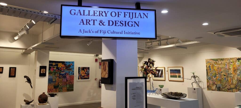 Art gallery space showing paintings and sculptures